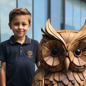 The boy created an owl from wood with his own hands in Germany