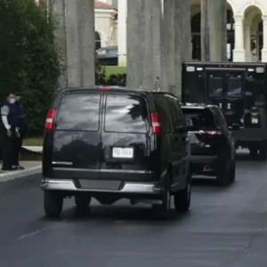 Two ambulances and secret service Scene leaving Mar-A-Logo