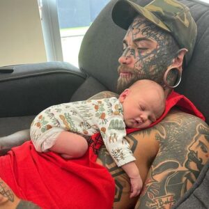 A 24 year old dad, whose body is completely covered with over 200 tattoos has started removing them for the sake of his baby daughter.