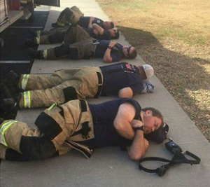 Man snaps heartbreaking photo of firefighters taking a rest after 24 hours of working nonstop